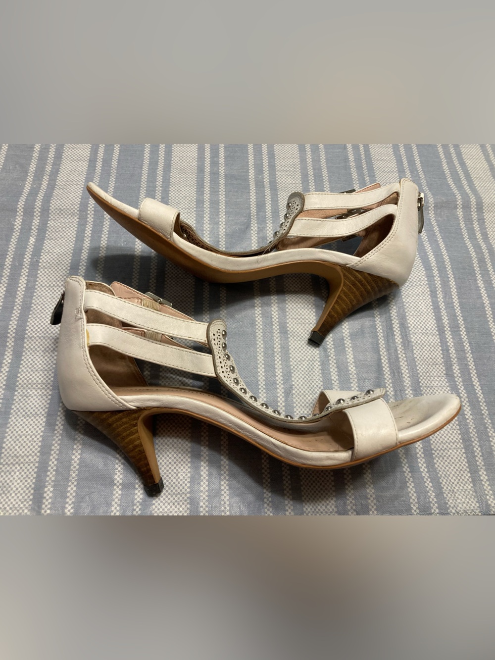 Audrey Brooke white heeled sandals.